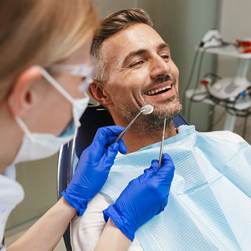smiling man at the dentist
